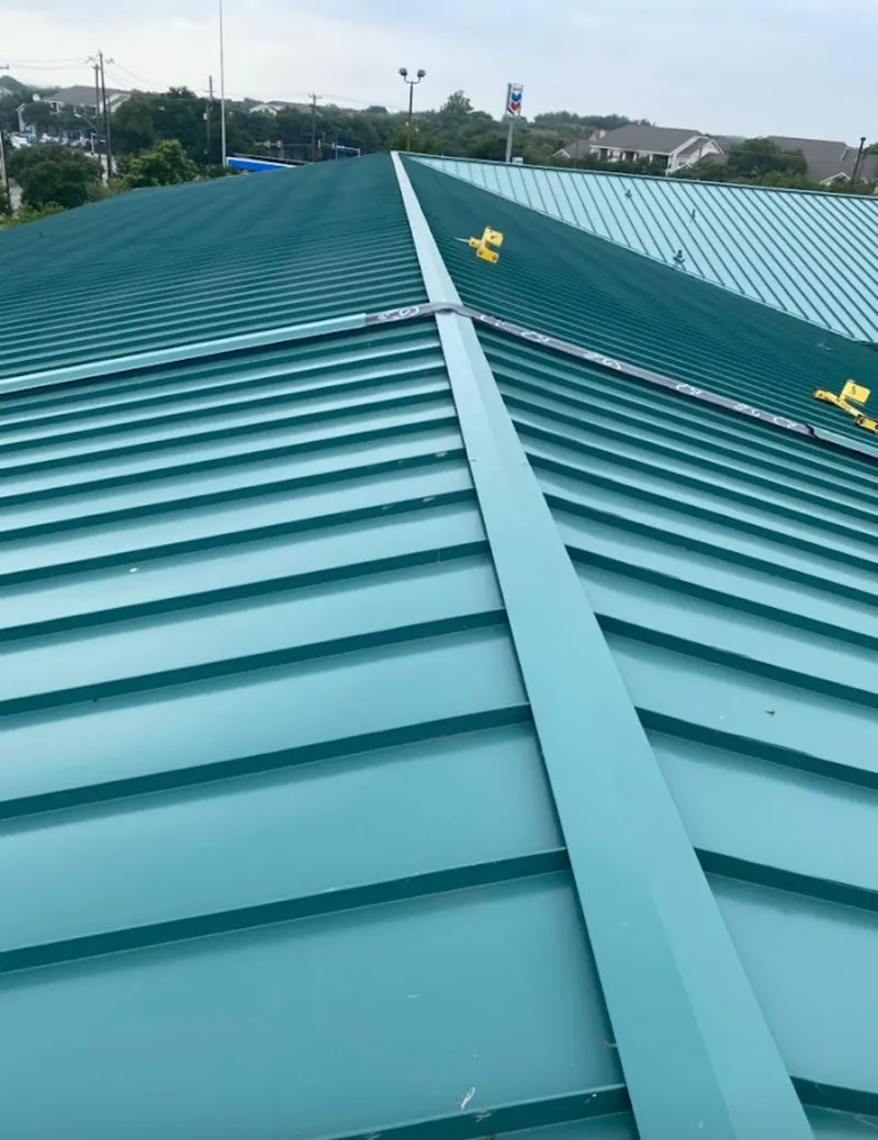 Green commercial metal roof ridge and valley for Metal Roof Repair in Lochearn